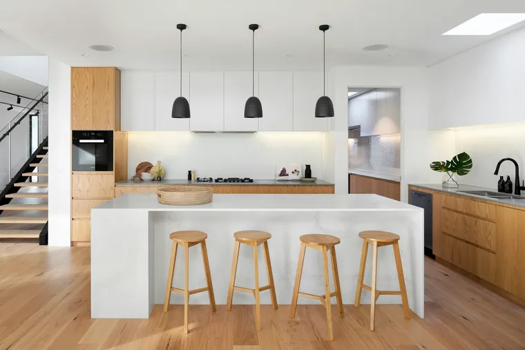 Kitchen with tile floor and quartz island